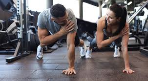 Toning Bingo Wings: Your Ultimate Guide to Sculpting Sleek Arms at the Gym 3 Fitness trainer demonstrating arm toning exercises Witley