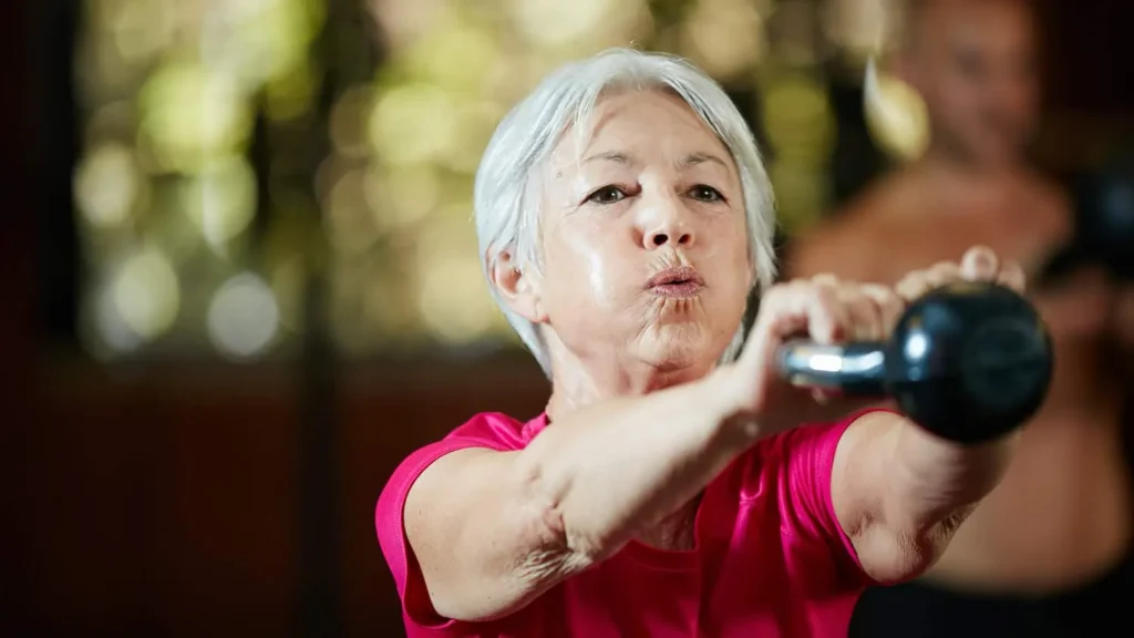 Toning Bingo Wings: Effective Exercises and Tips for Achieving Sleeker Arms 2 Person performing arm exercises with dumbbells Witley