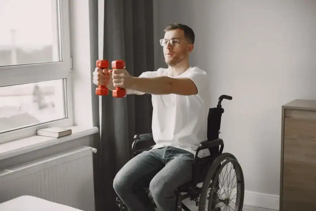 Image of man doing exercise in his wheelchair to aid weight loss Witley