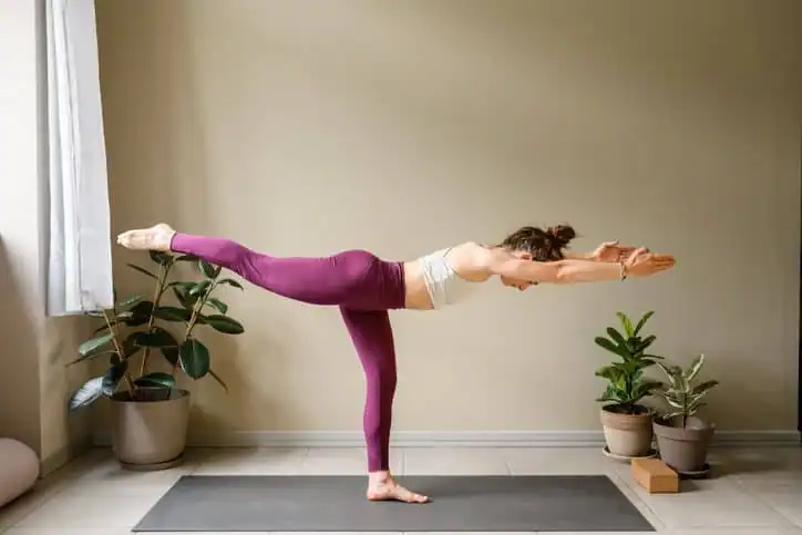 Achieving the Perfect Tone: How Often Should You Exercise for Results? 1 Woman doing Yoga exercise Witley to help with toning the body.