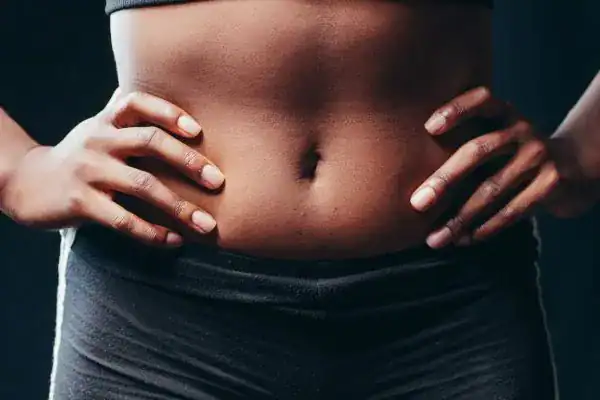 Toning Your Stomach: The Ultimate Guide to Achieving a Sculpted Stomach While Shedding Pounds 1 Image of a toned stomach after non surgical treatment Witley